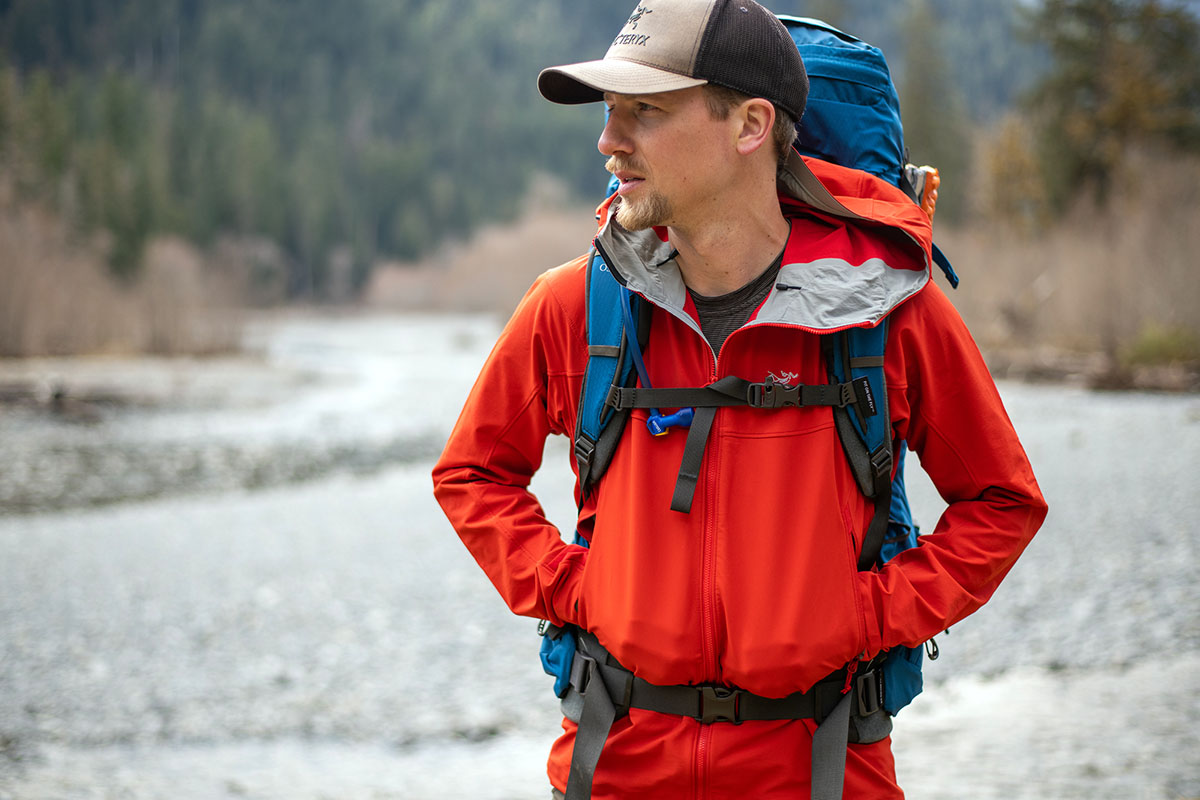 Walking next to the water on a backpacking trip while wearing the Arc'teryx Gamma LT Hoody
