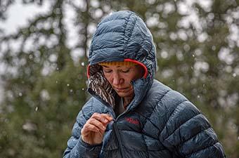 Down Fill and Insulation Explained (zipping up Rab Mythic G down jacket)